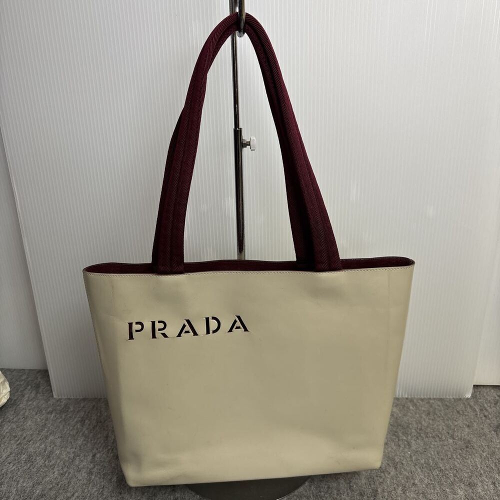 Prada tote bag punch through logo front White